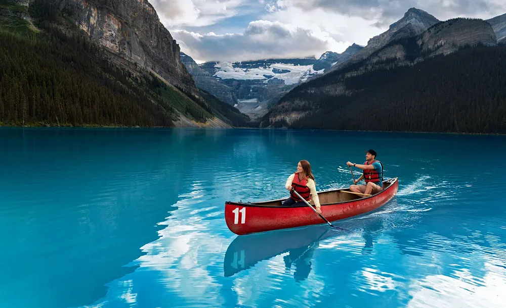 Images like this are used to promote visitation to areas like Lake Louise; this idealized version is not something that tourists actually get | Roth and Ramberg | Travel Alberta