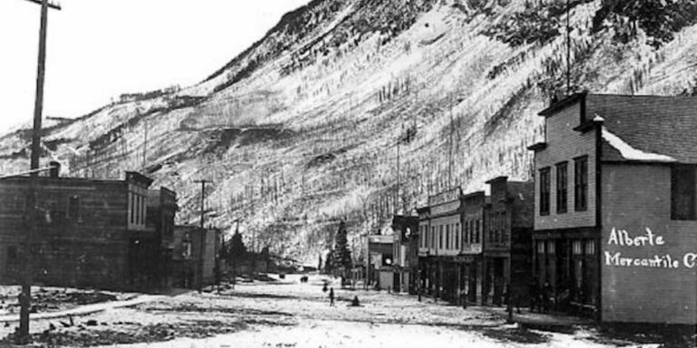 A historical black-and-white photo of the Frank, Alberta