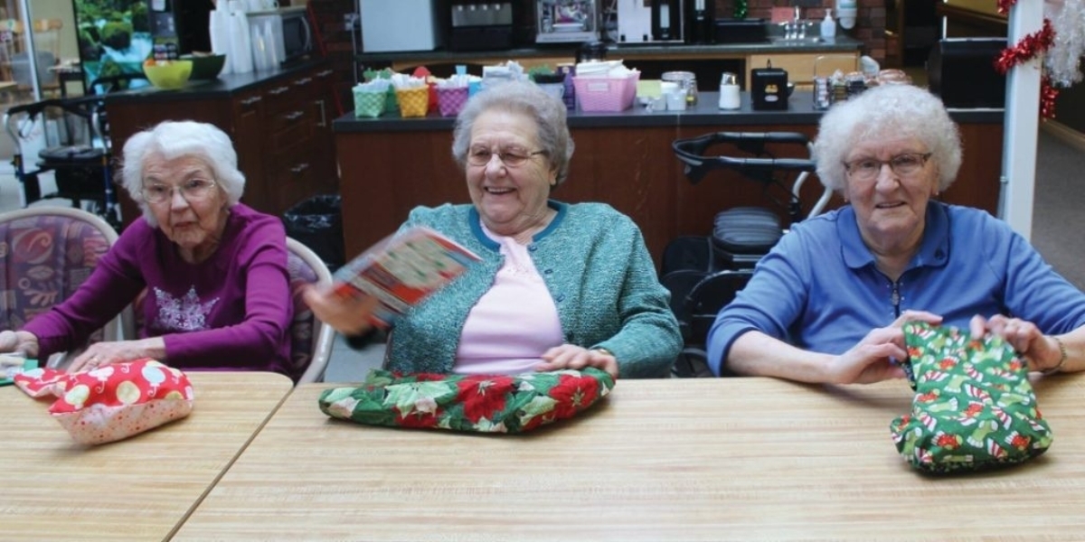 Thelma Cartwright, Cristel Dusterhoft, and Ann Menning at last years Stockings for Seniors event