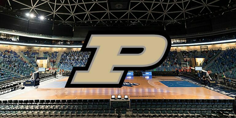 The Purdue Boilermakers' logo over a background of a massive indoor basketball court