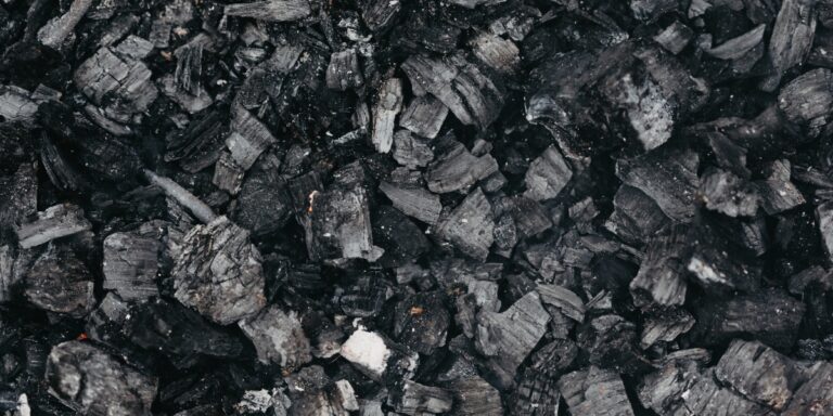 a photo of a pile of coal featuring different shades of gray