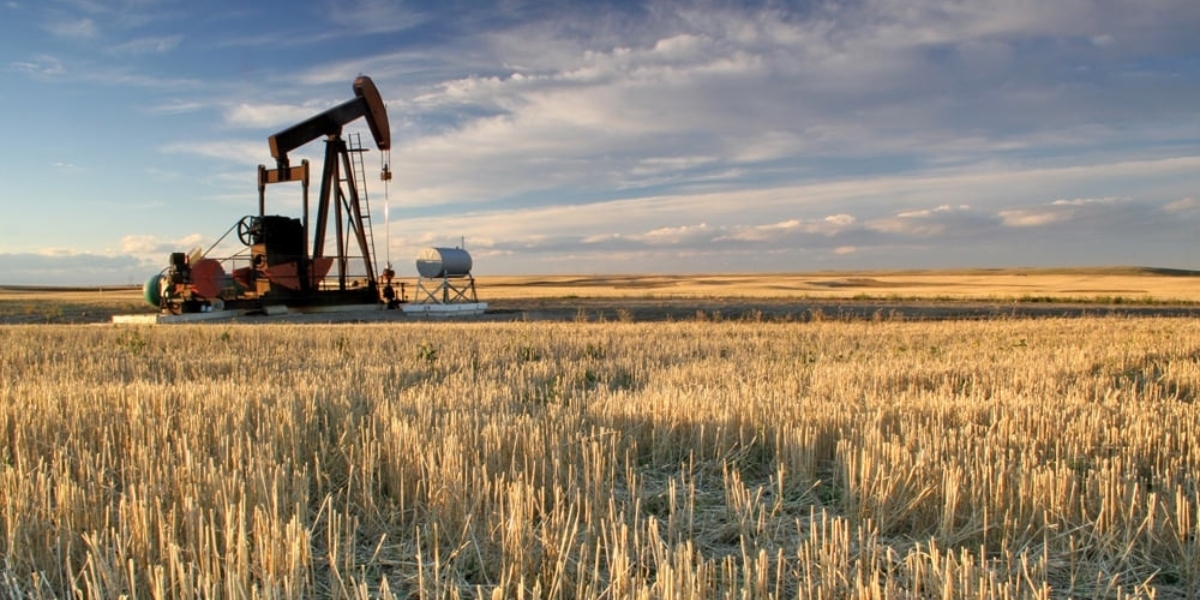 a generic image of an oil rig and an open field indicating that it has been abandoned