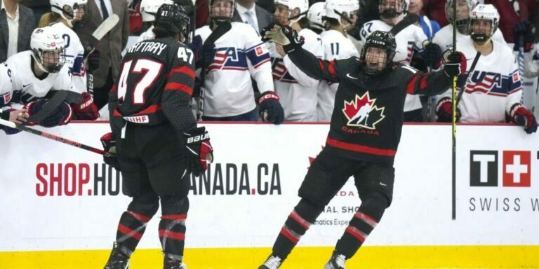 rattray celebrating with fellow teammate after securing the win over USA