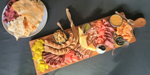 the land and sea charcuterie board from aalto showing off various meats cheeses and veggies