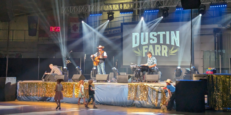 Dustin Farr performing at the Mountain View Tornado Benefit Concert at the Carstairs Memorial Arena on July 29, 2023
