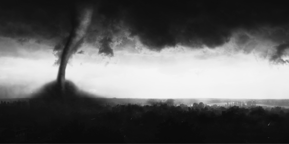a black and white photo of a tornado on the skyline
