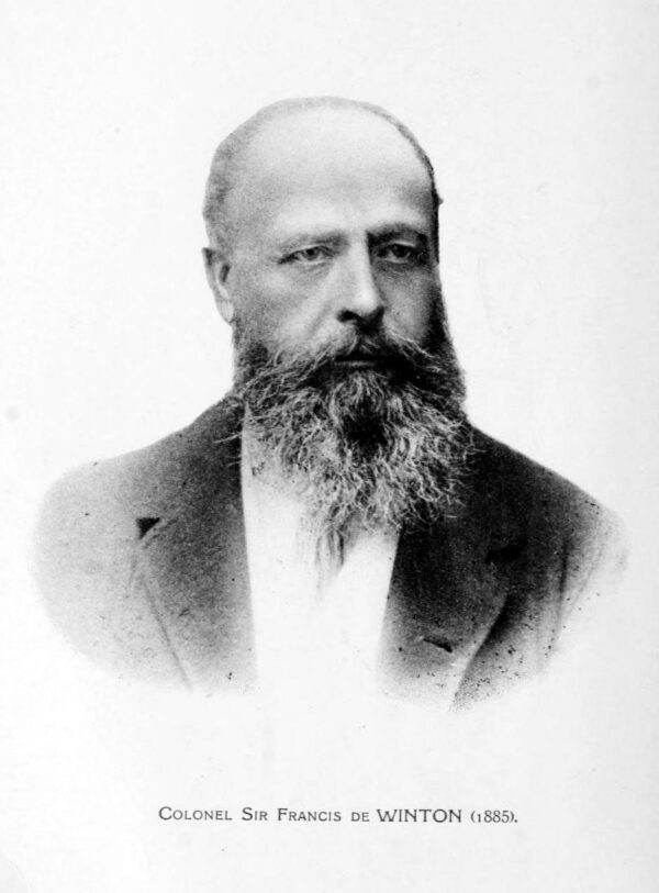 a black and white photo of sir francis de winton who has a bushy beard and balding head