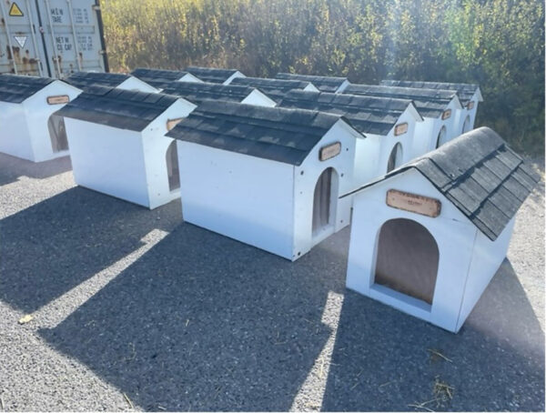 A stack of freshly built dog houses