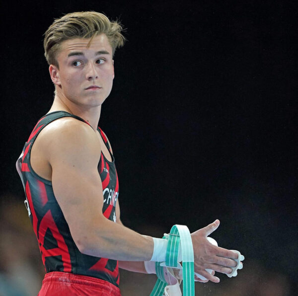 gymnist Felix Dolci portrait while in action at gymnastic competitition
