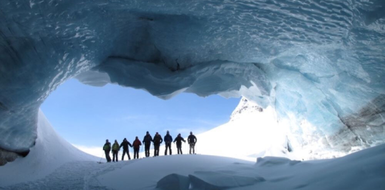 Skiers in gian ice cave