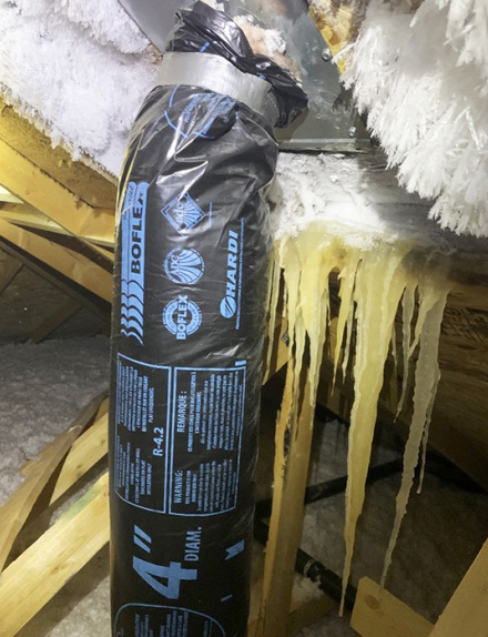Leaking ductwork from a bathroom vent pumped humidity into this attic, creating a wall of icicles | Cody Sager | Instagram
