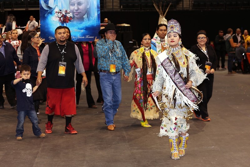 Tia at the 2014 Manito Ahbee Festival in Manitoba, where she was named the Miss Manito Ahbee Youth Ambassador. Pictured behind her is her sister Fawn Wood and her parents | Lakeland Today 