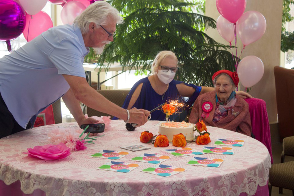 A happy Mary Picken celebrating her 100th birthday with a cake  Daniel Gonzalez  The Cochrane Eagle