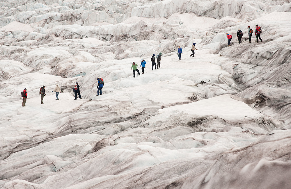 Tourists explore the Athabasca Glacier | Darwin Wiggett | oopoomoo