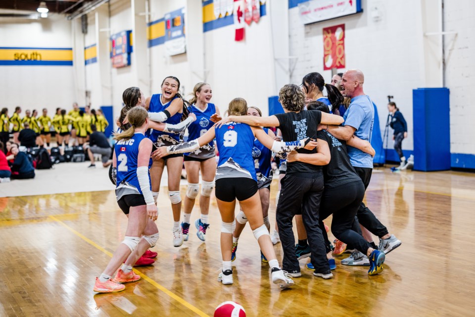 The RMVC's U15 girls celebrating their gold medal win at the Alberta Premier tournament | Jenna Grey Photography | Rocky Mountain Outlook