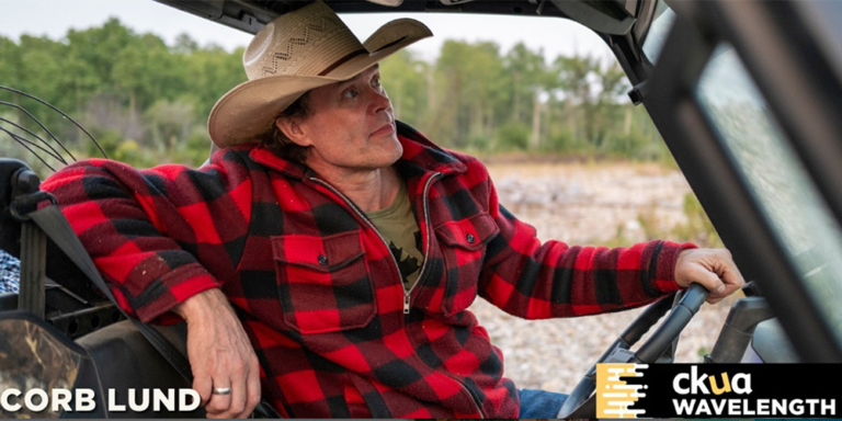 Country singer Corb Lund in a vehicle
