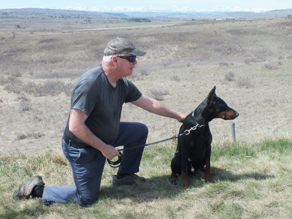 Craig Campbell with his 10-year-old Doberman named Night 