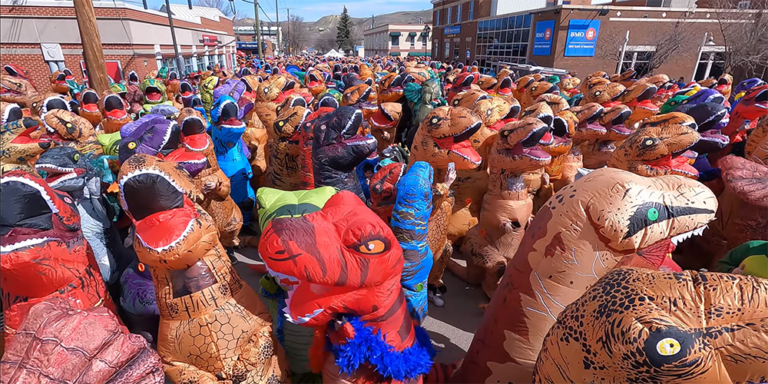People dressed up in Dinosaur costumes in Drumheller