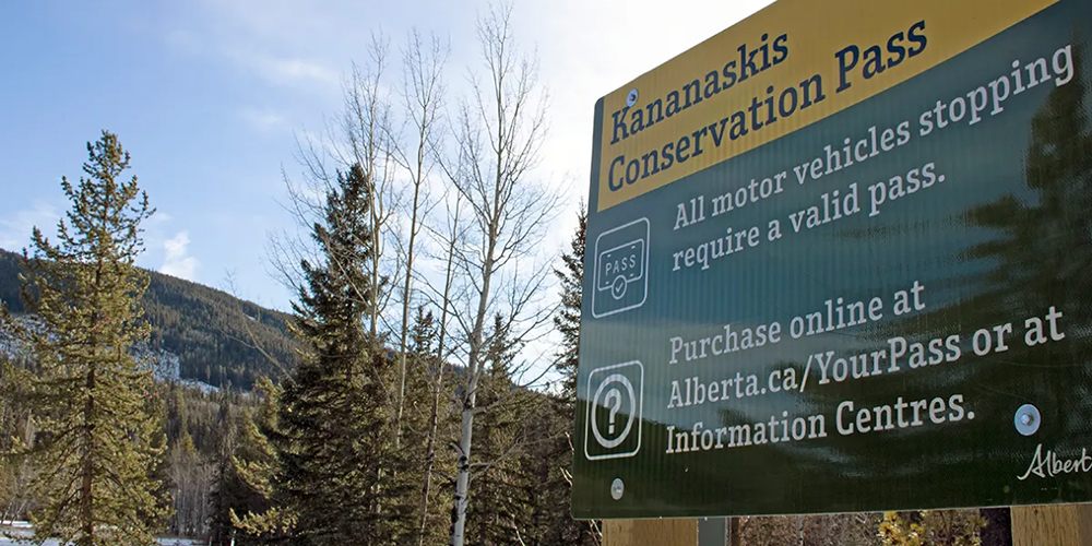 Notification sign for the Kananaskis Conservation Pass